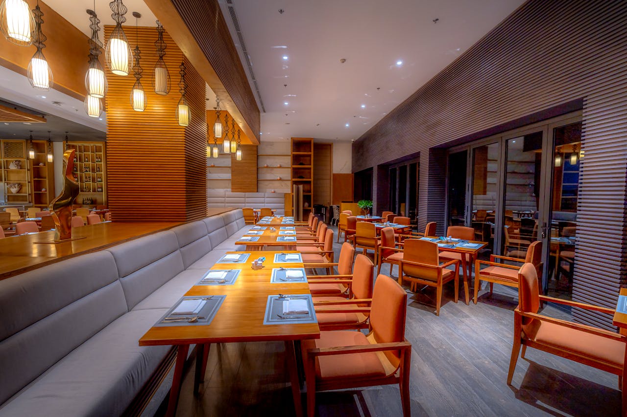 gallery-01 Elegant modern restaurant interior with stylish lighting and seating arrangement.