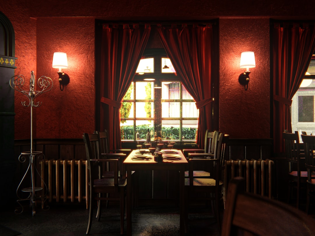 a-dimly-lit-dining-room-with-red-walls-f4jiliqxqla