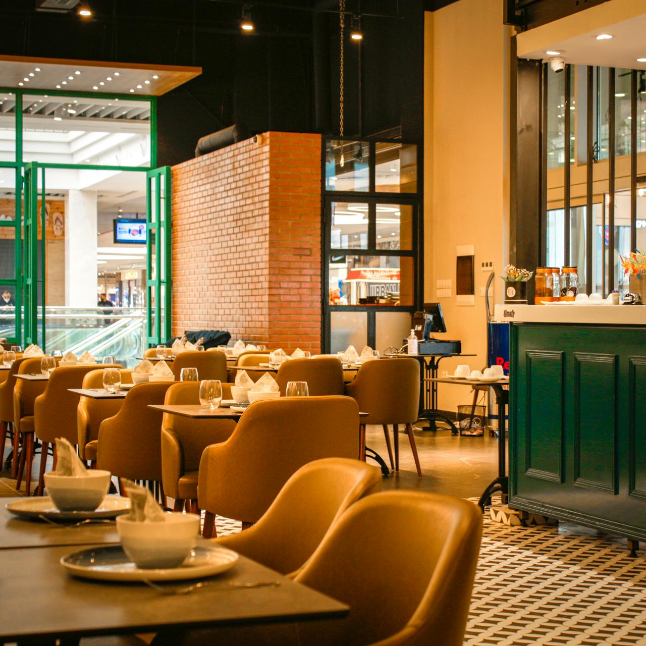 home-img A stylish café interior showcasing contemporary design and elegant seating arrangements.